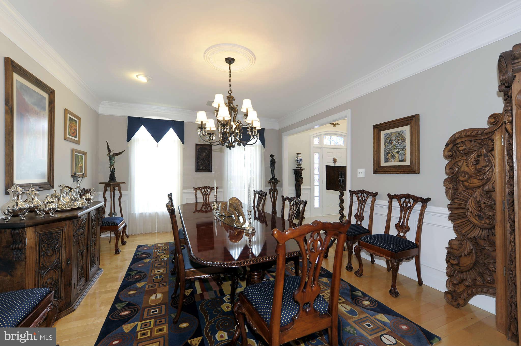 10404 Grey Fox Road Potomac, MD 20854 - Photo 4 of 30 a view of a dining room with furniture and chandelier