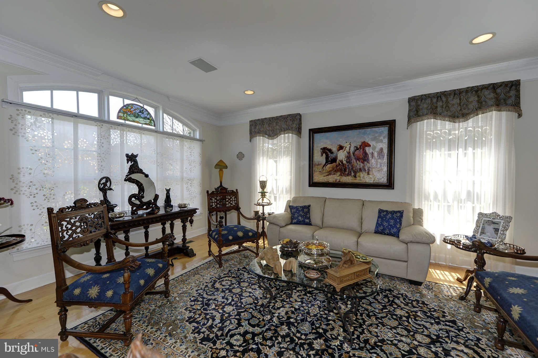 10404 Grey Fox Road Potomac, MD 20854 - Photo 5 of 30 a living room with furniture and wooden floor