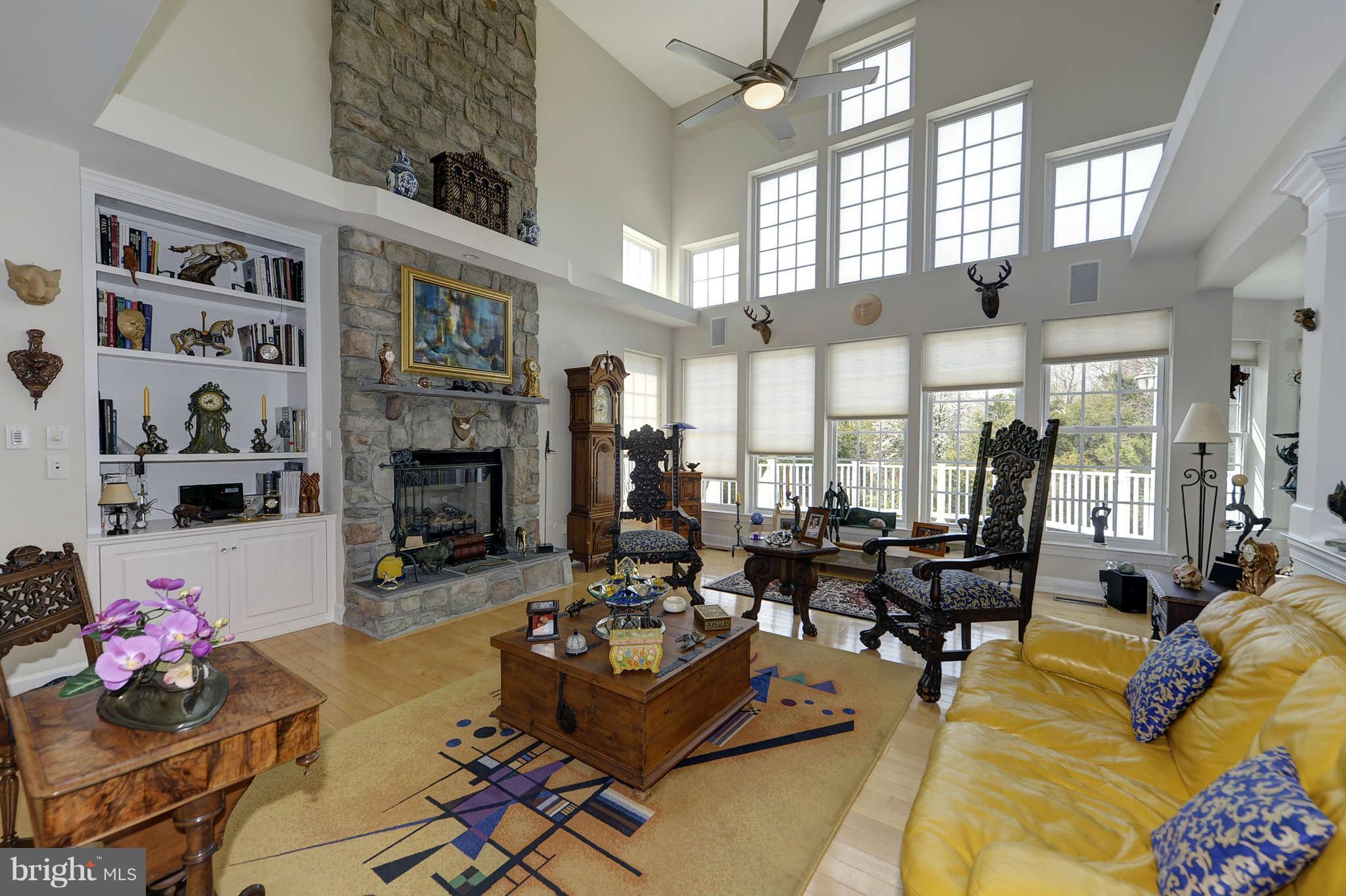 10404 Grey Fox Road Potomac, MD 20854 - Photo 7 of 30 a living room with fireplace furniture and decor