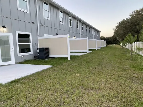 a view of a house with a yard and garage