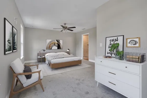 a bedroom with a bed and a dresser