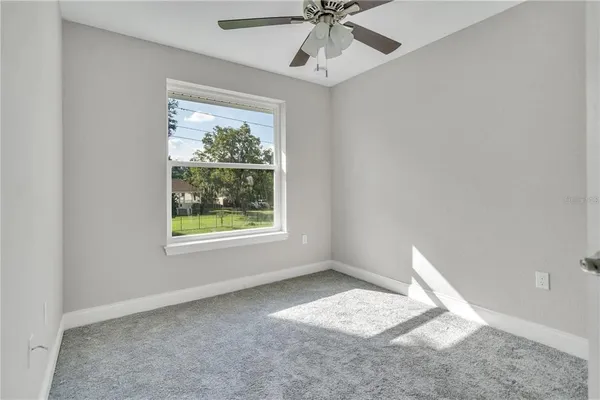 a view of an empty room with a window