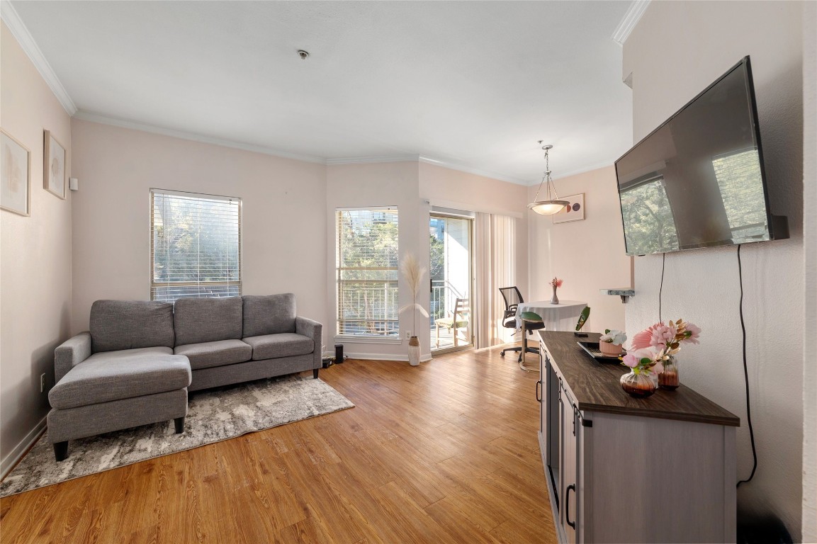 a living room with furniture and a flat screen tv