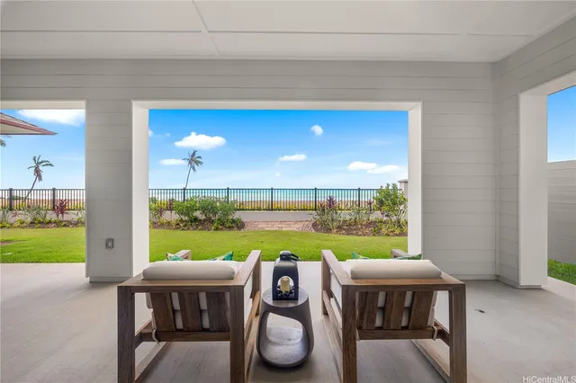 a view of an outdoor dining space with furniture and garden