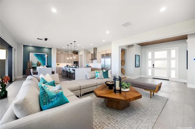 a living room with furniture and a large window