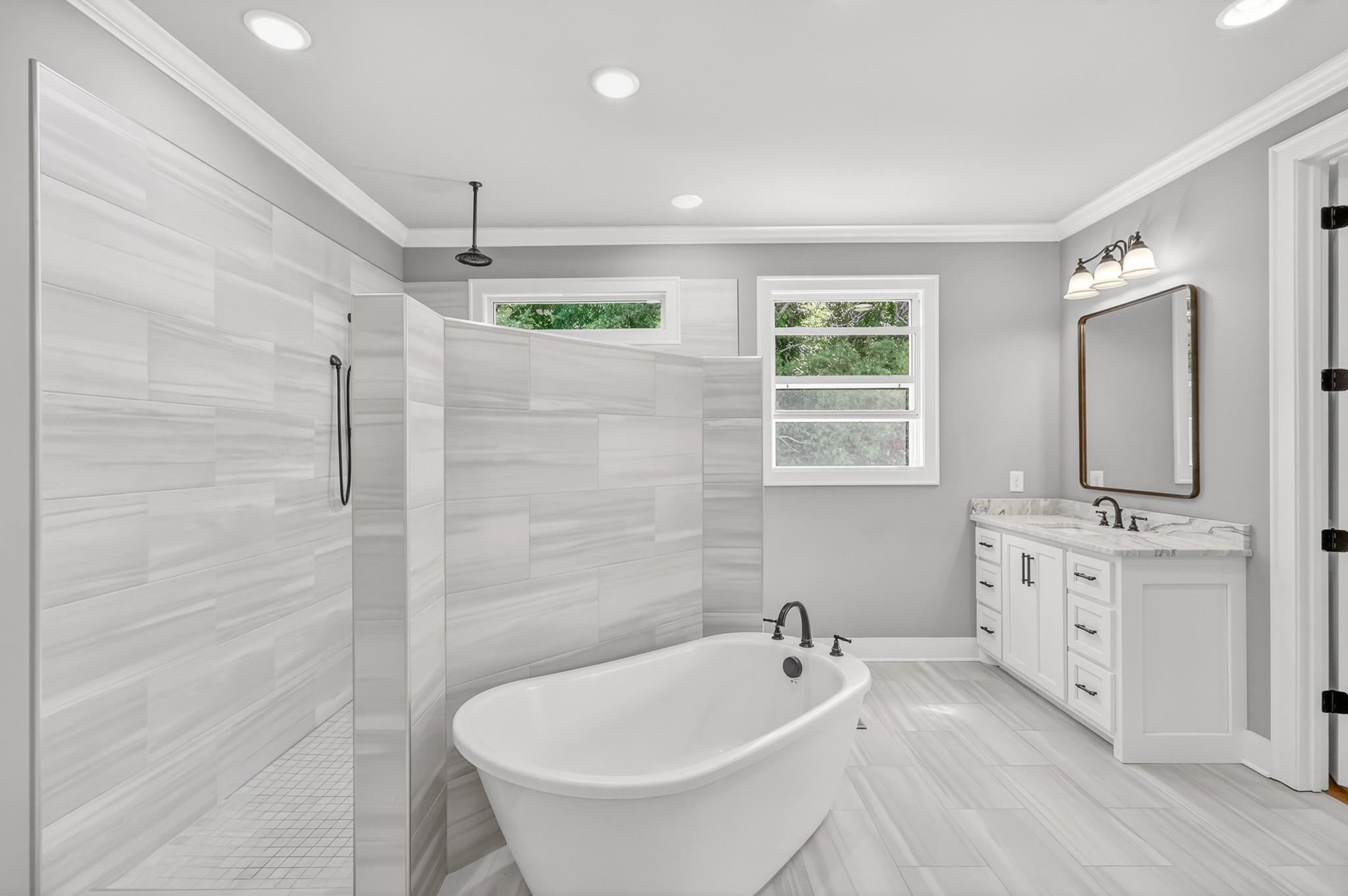 1176 Iron Bridge Road Columbia, TN 38401 - Photo 30 of 53 a bathroom with a tub sink and mirror