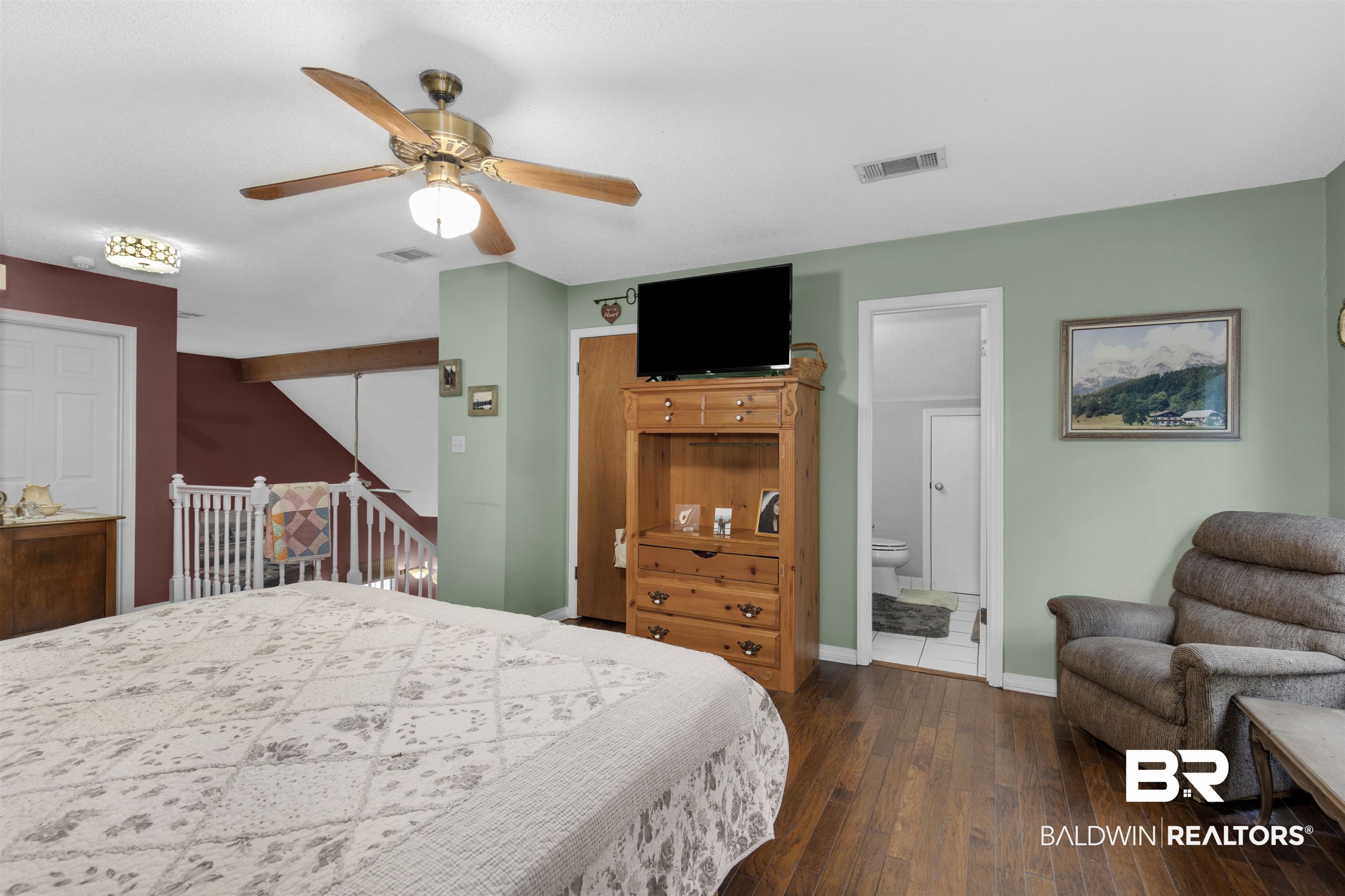 31375 Stagecoach Road Daphne, AL 36527 - Photo 15 of 21 Bedroom with hardwood / wood-style flooring, baseboards, ceiling fan, and ensuite bathroom