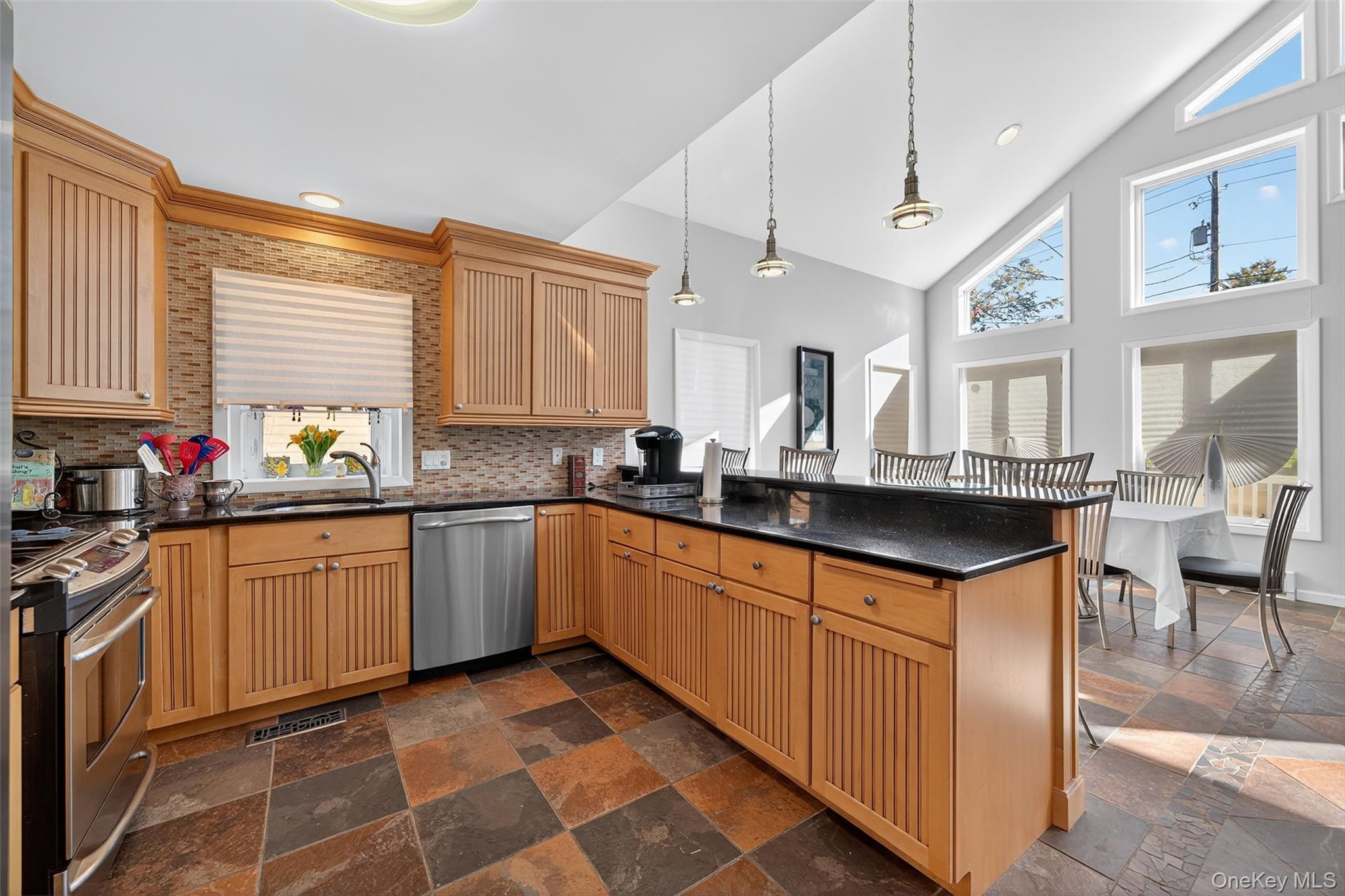 518 Sackett Lake Road Monticello, NY 12701 - Photo 13 of 44 a kitchen with stainless steel appliances granite countertop a sink and cabinets