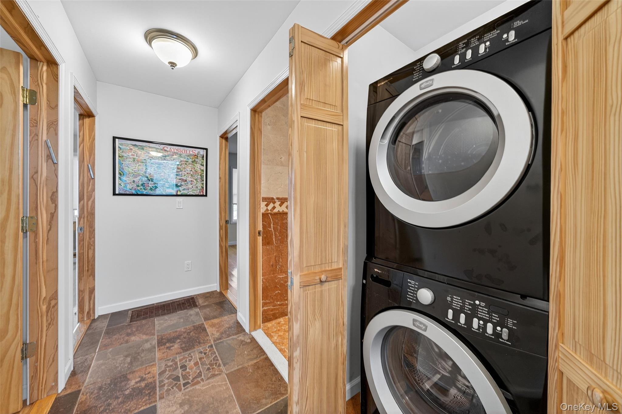 518 Sackett Lake Road Monticello, NY 12701 - Photo 19 of 44 a view of a hallway with washer and dryer