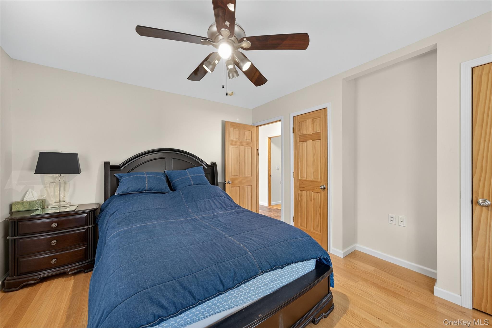518 Sackett Lake Road Monticello, NY 12701 - Photo 21 of 44 a bedroom with a bed and wooden floor