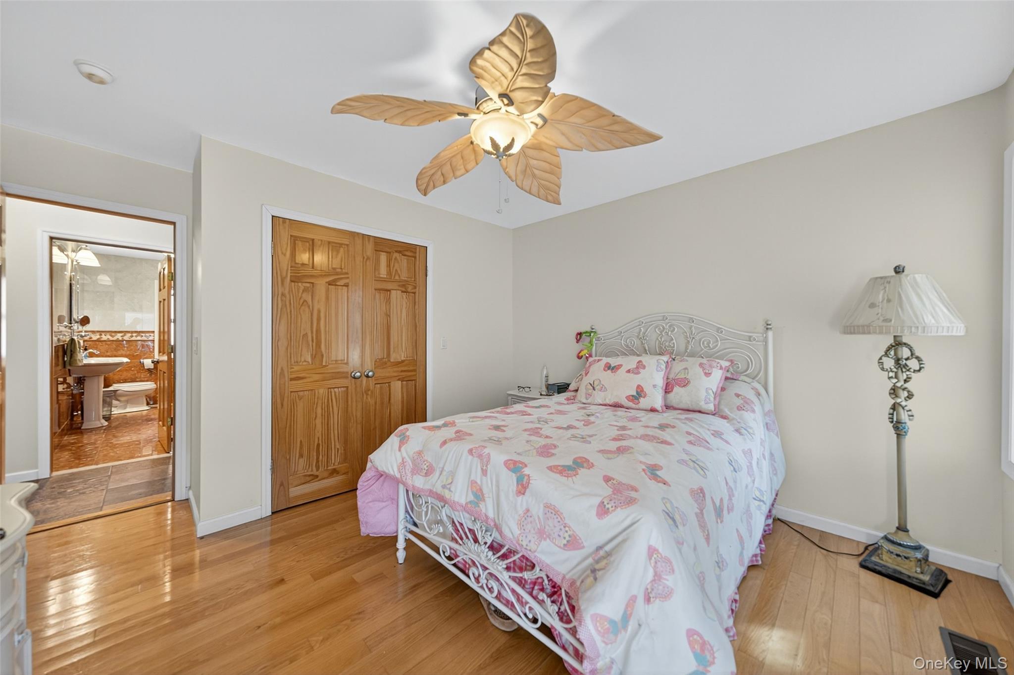 518 Sackett Lake Road Monticello, NY 12701 - Photo 23 of 44 a bedroom with a bed and wooden floor