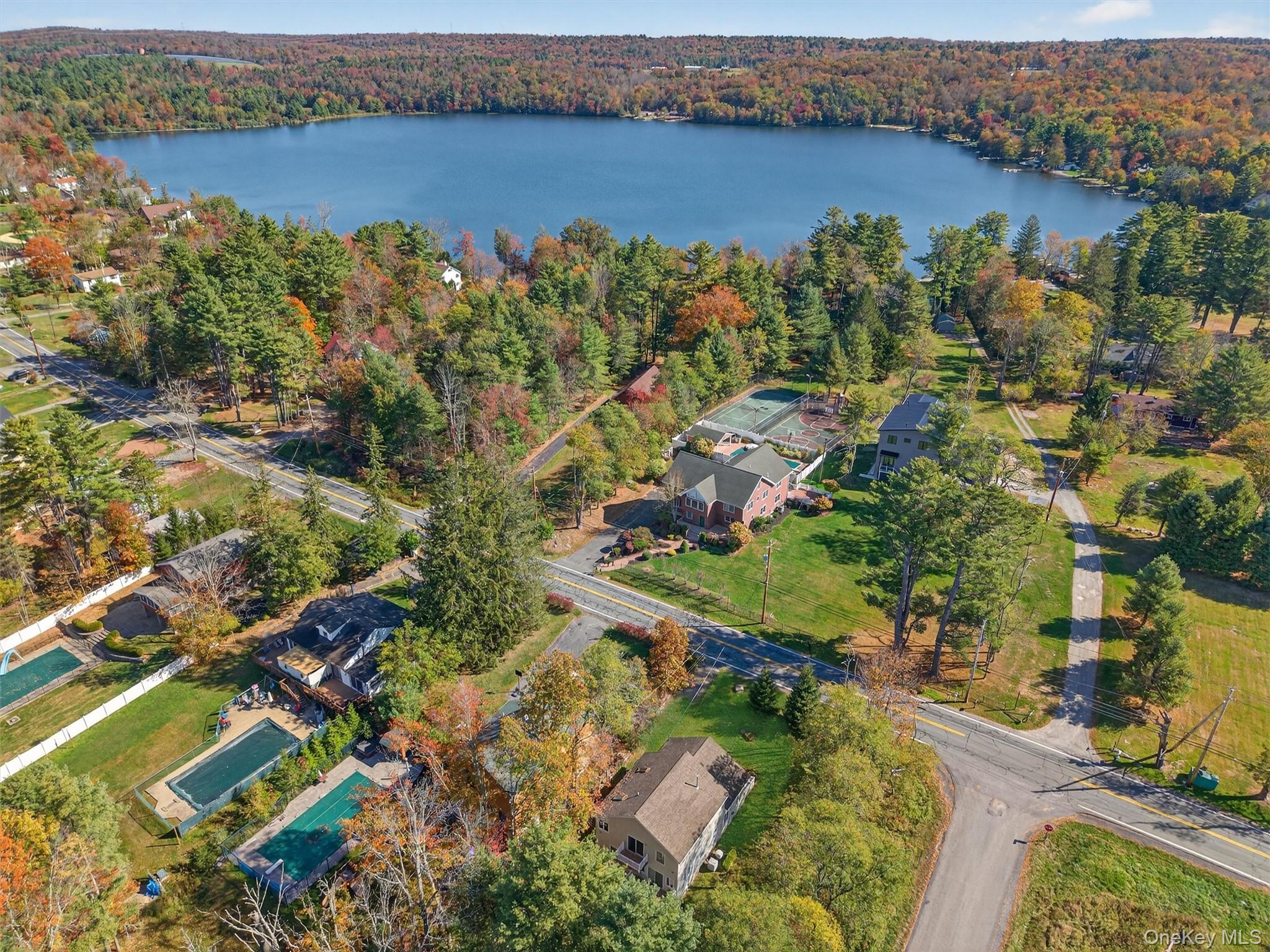 518 Sackett Lake Road Monticello, NY 12701 - Photo 3 of 44 an aerial view of a houses with a lake view