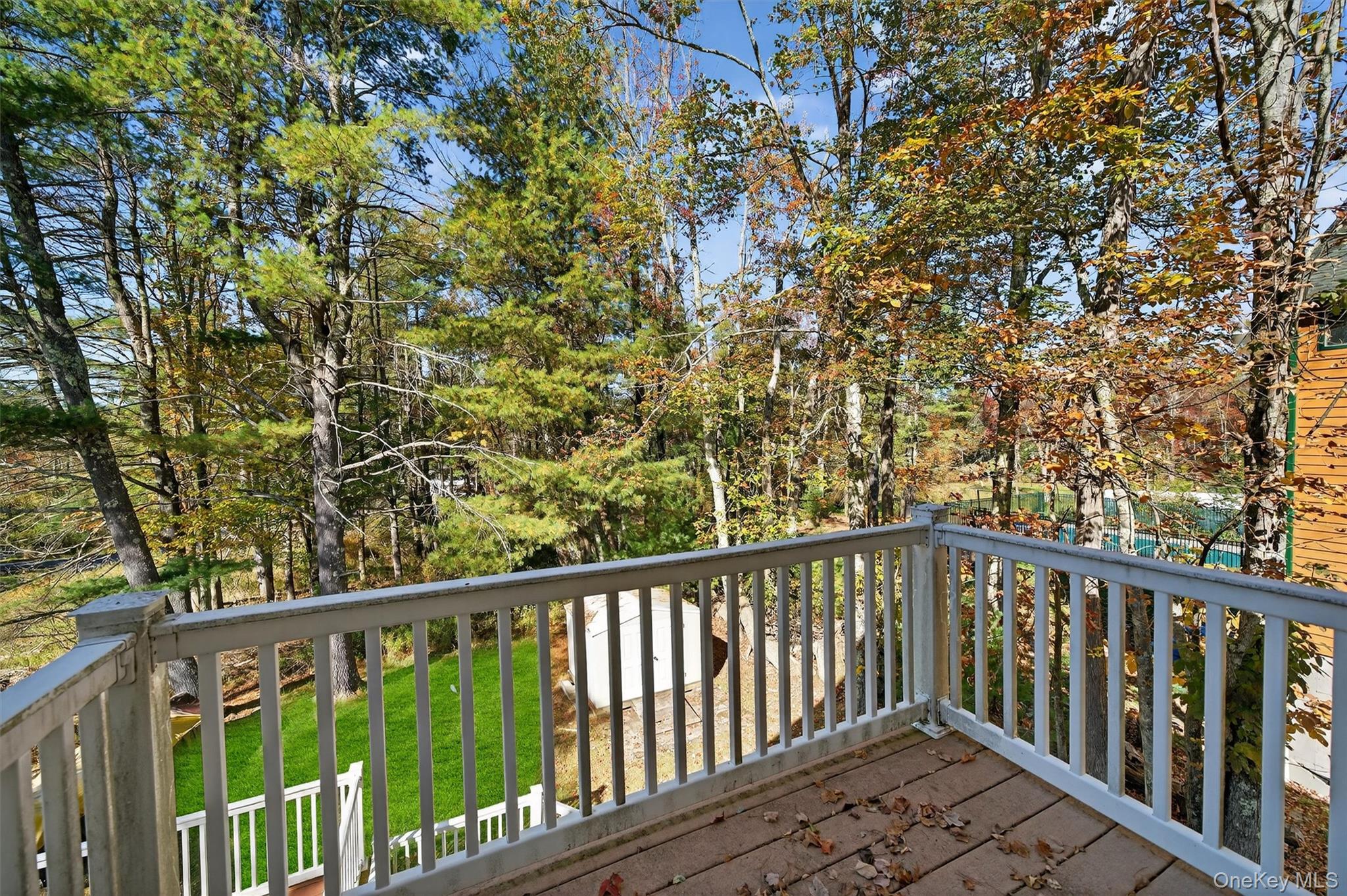 518 Sackett Lake Road Monticello, NY 12701 - Photo 31 of 44 a view of a balcony with wooden fence and floor