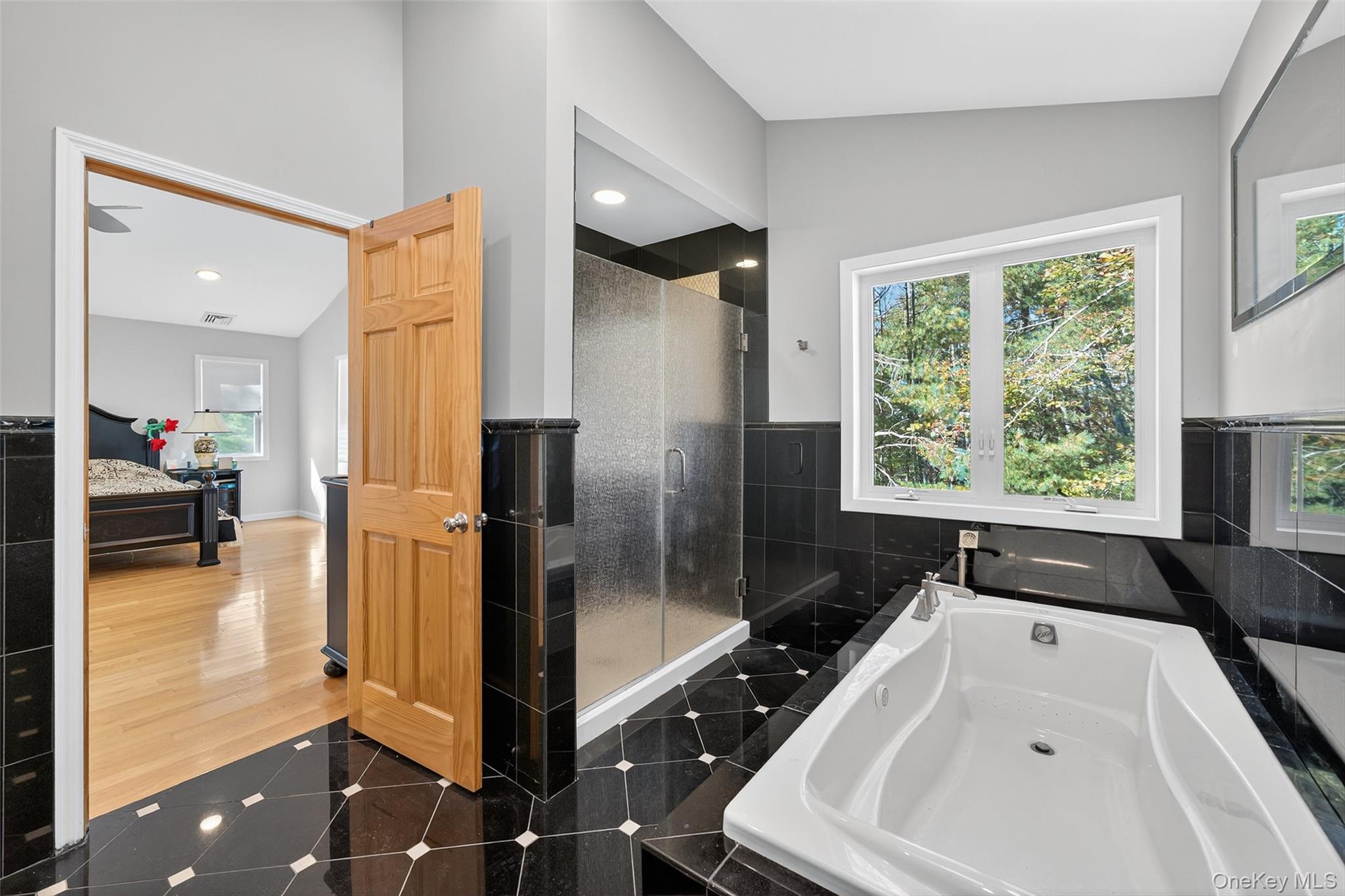 518 Sackett Lake Road Monticello, NY 12701 - Photo 35 of 44 a bathroom with a bathtub and a shower