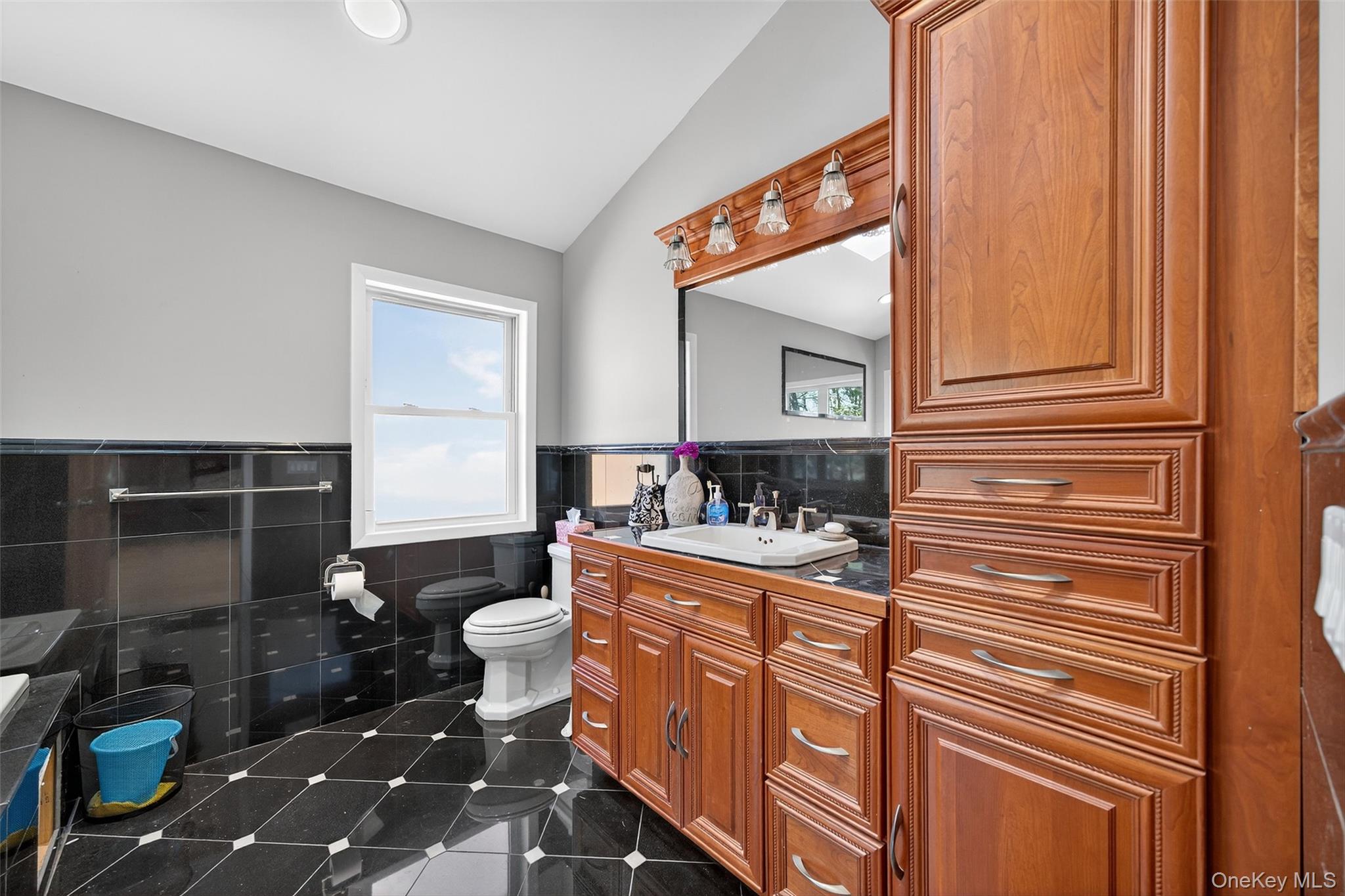 518 Sackett Lake Road Monticello, NY 12701 - Photo 36 of 44 a bathroom with a sink a toilet and shower