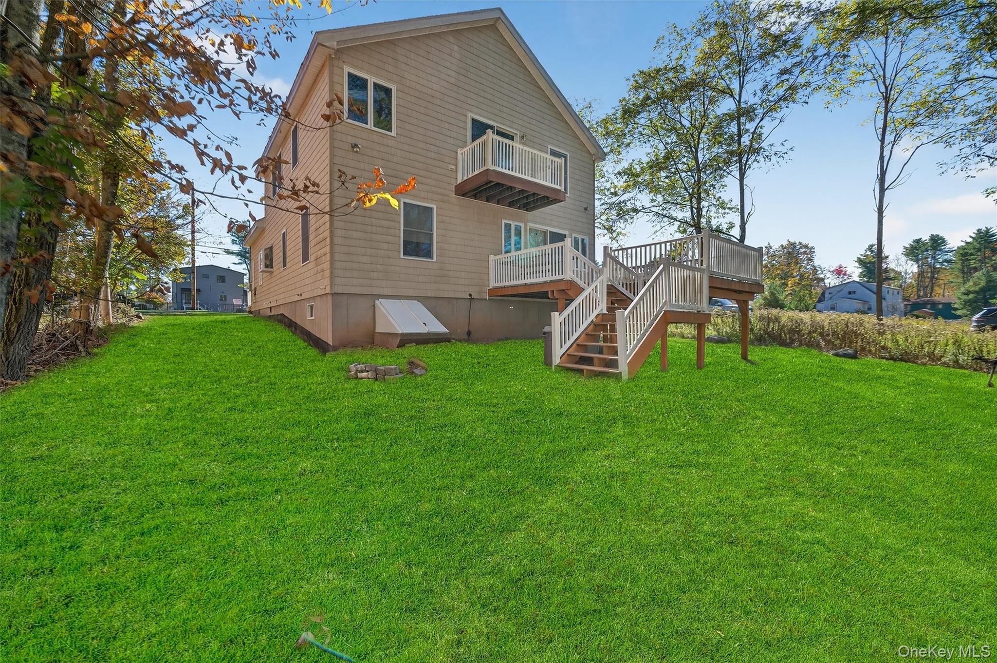 518 Sackett Lake Road Monticello, NY 12701 - Photo 38 of 44 a view of a house with a backyard