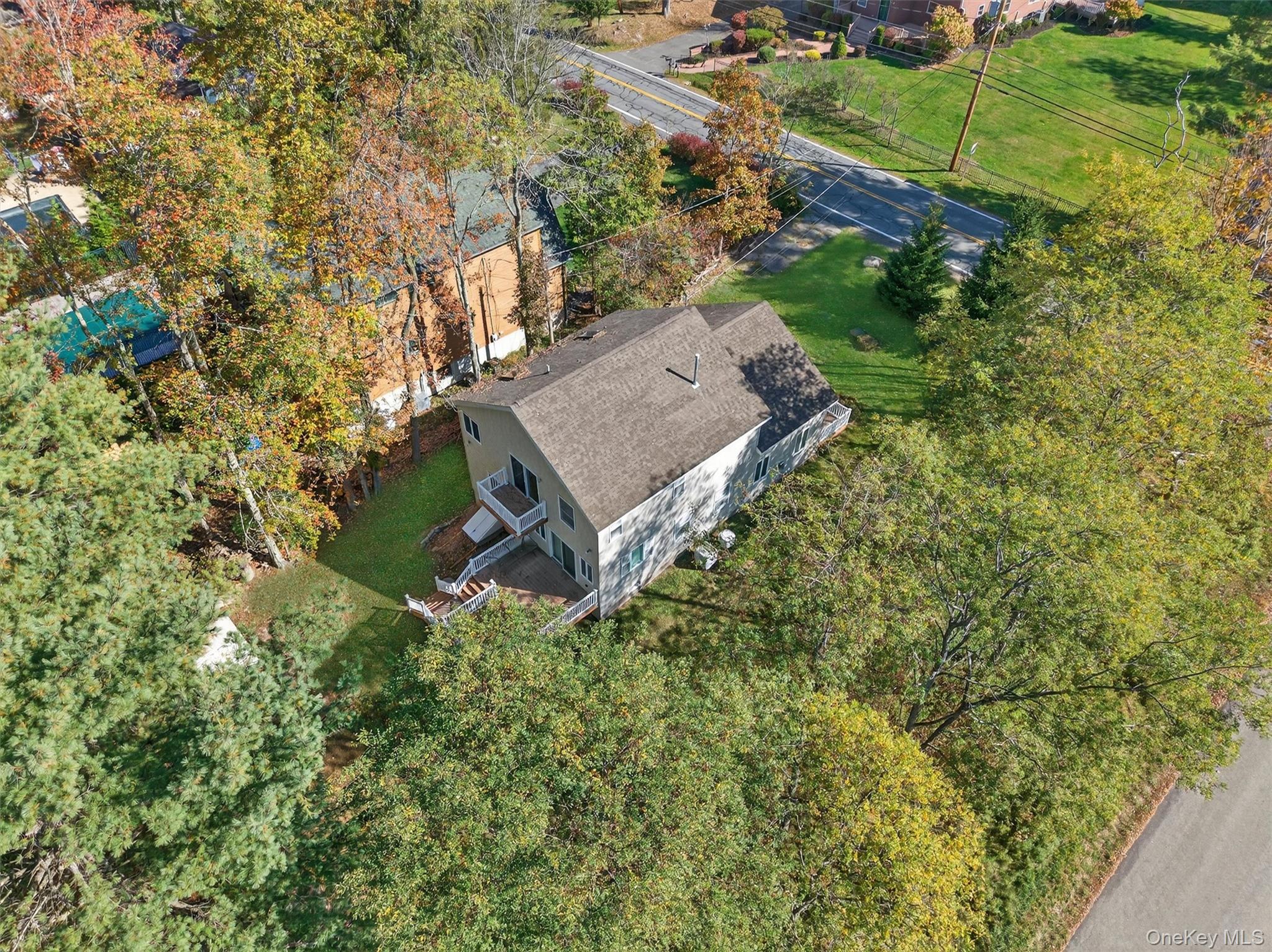 518 Sackett Lake Road Monticello, NY 12701 - Photo 6 of 44 an aerial view of a house with a yard