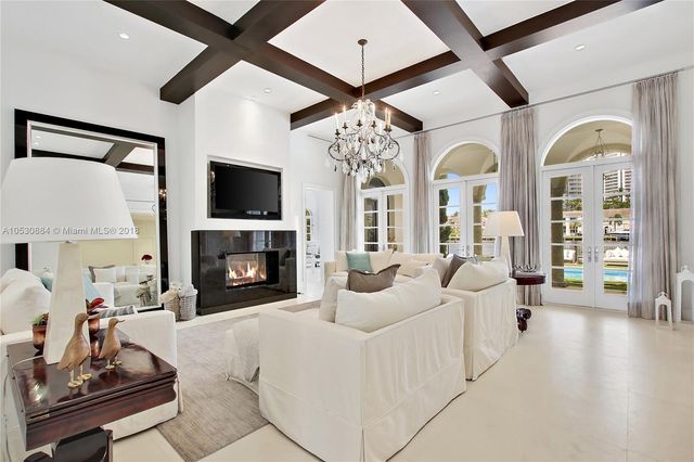a living room with furniture fireplace and flat screen tv