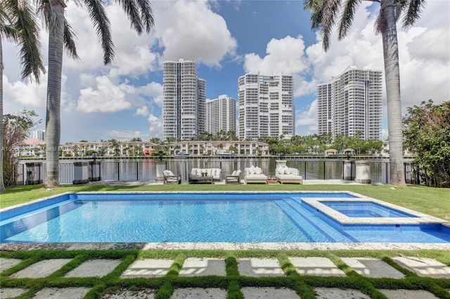 a front view of a house with swimming pool