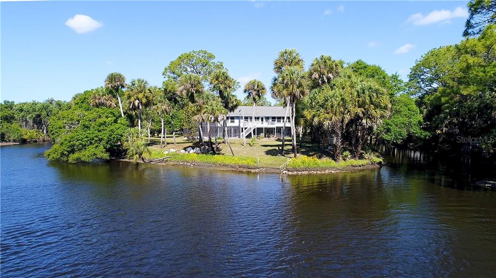 a view of a lake with a building in the background