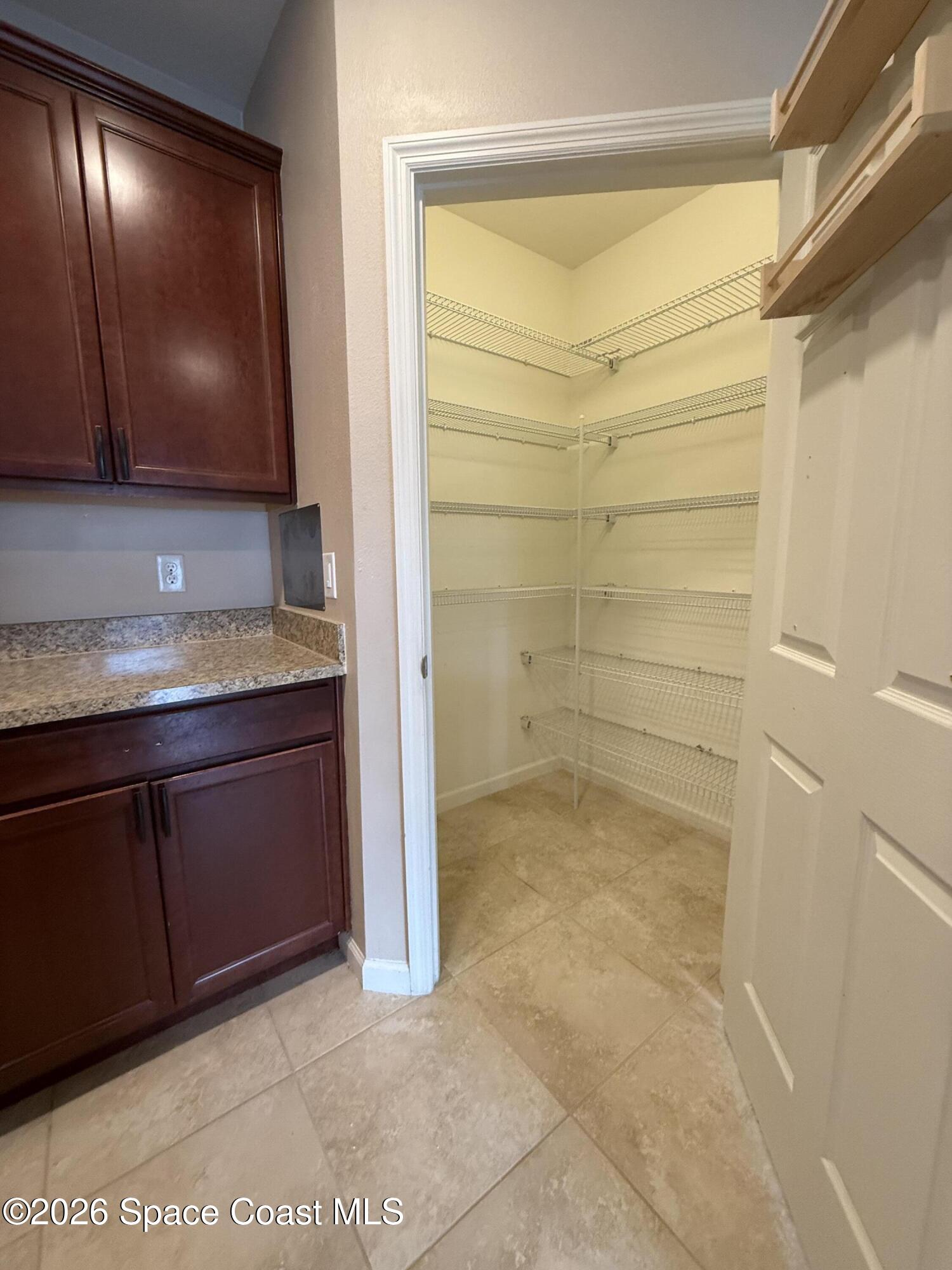 1070 Swiss Pointe Lane Rockledge, FL 32955 - Photo 6 of 18 a bathroom with a granite countertop sink a mirror and shower