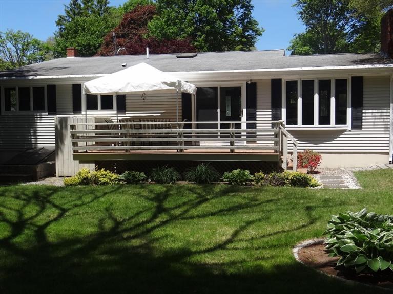 22 Millbrook Road Bourne, MA 02532 - Photo 3 of 25 a front view of a house with a yard