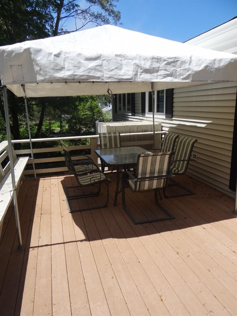 22 Millbrook Road Bourne, MA 02532 - Photo 6 of 25 a view of a patio with couches table and chairs