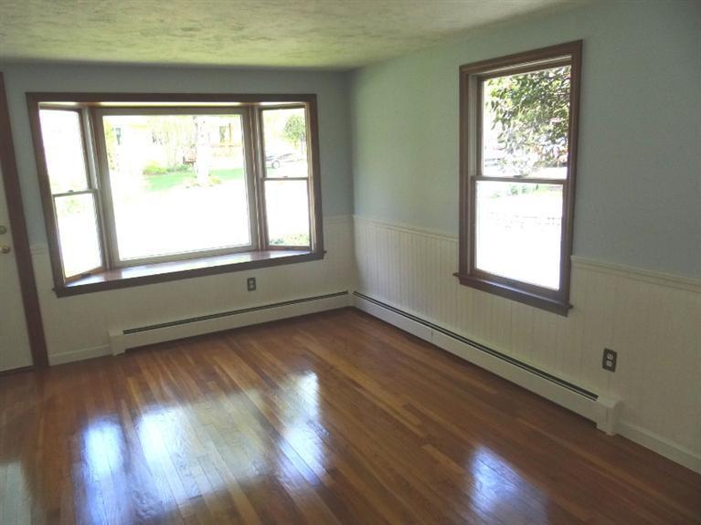 22 Millbrook Road Bourne, MA 02532 - Photo 9 of 25 a view of an empty room with wooden floor and a window