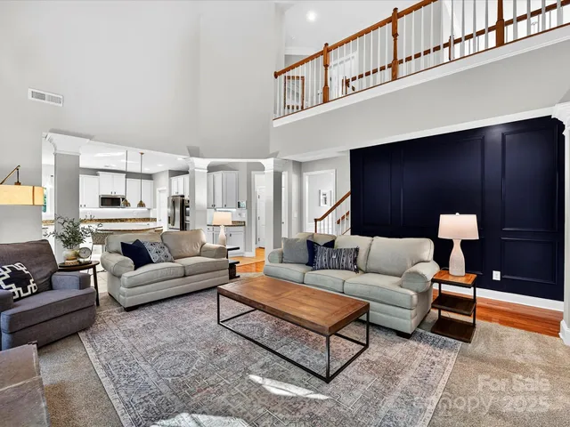 a living room with furniture and a rug