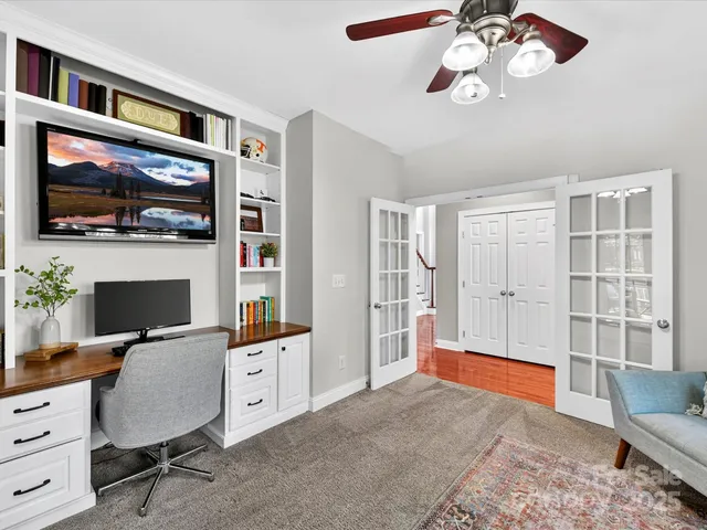 a living room with furniture fireplace and flat screen tv