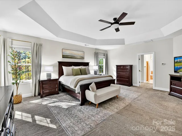 a bedroom with a bed and a couch