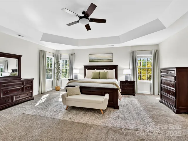 a bedroom with a bed and a television