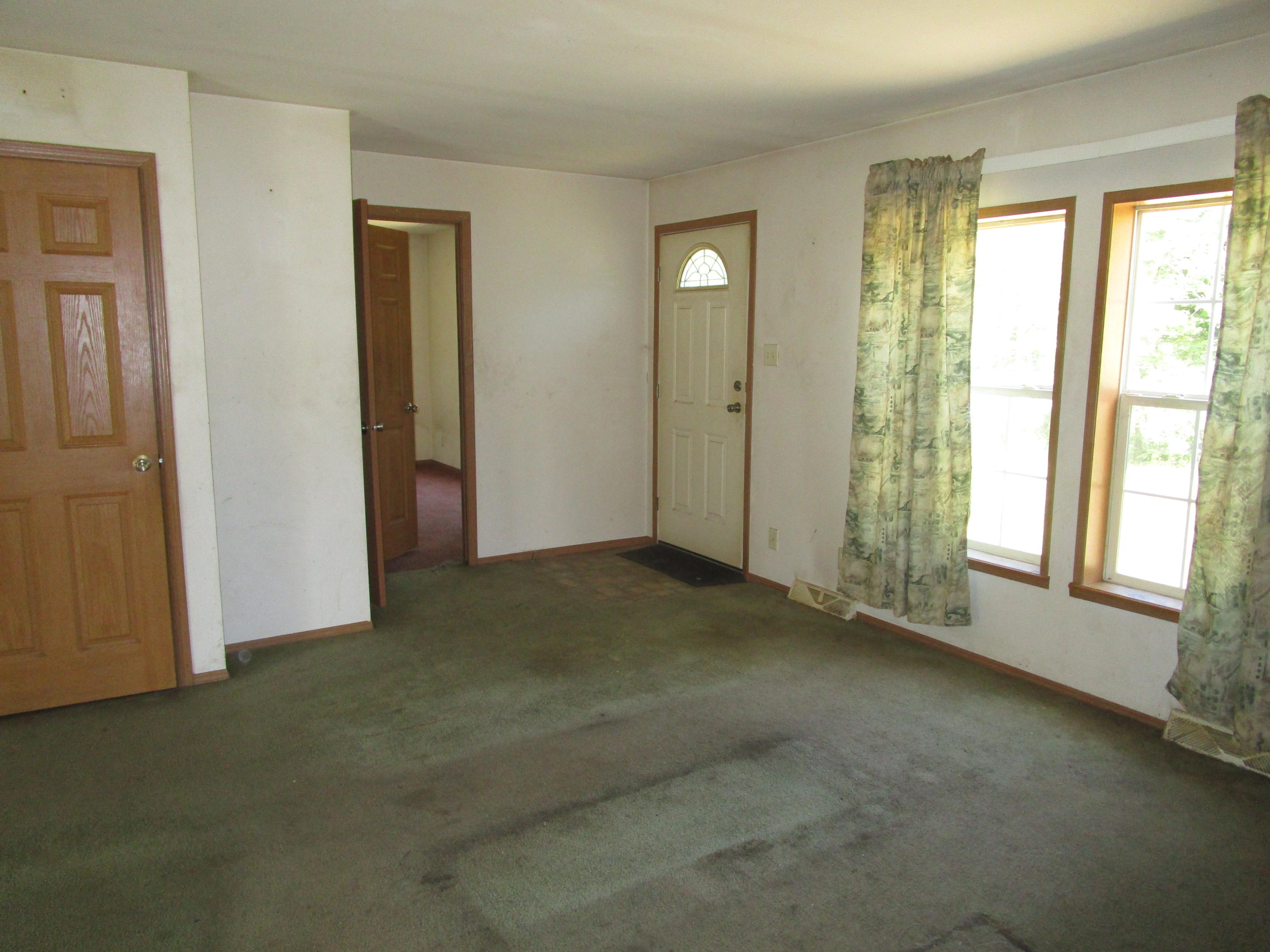 621 County Road Milford, ME 04461 - Photo 12 of 18 Front Entrance into Living Room