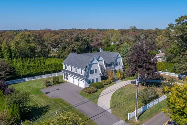a view of a garden with a building in the background
