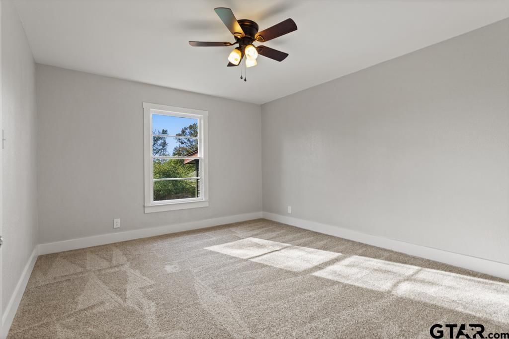 2819 New Copeland Road Tyler, TX 75701 - Photo 21 of 39 wooden floor in an empty room with a window