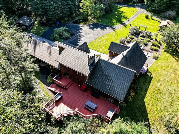an aerial view of residential house with swimming pool and outdoor space