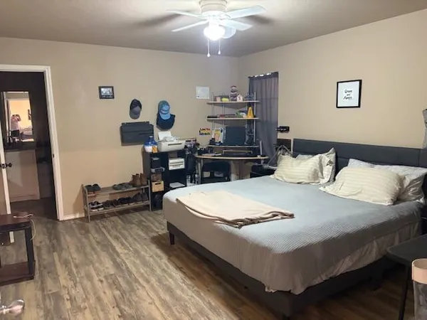 a view of a backyard with wooden fence
