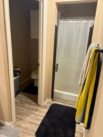 a view of a backyard with wooden fence