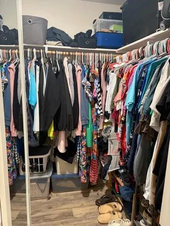 a bedroom with a bed and a television in it