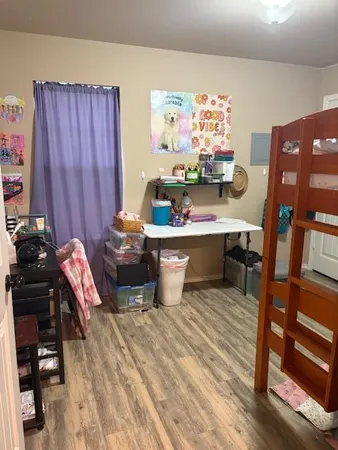 a view of storage and utility room with empty racks