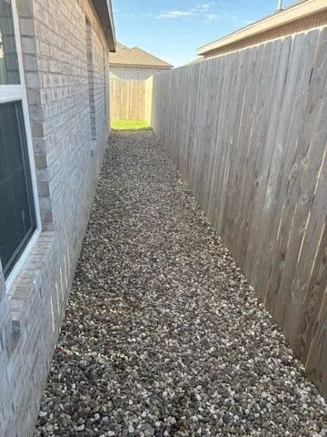 a bathroom with a granite countertop sink and a toilet