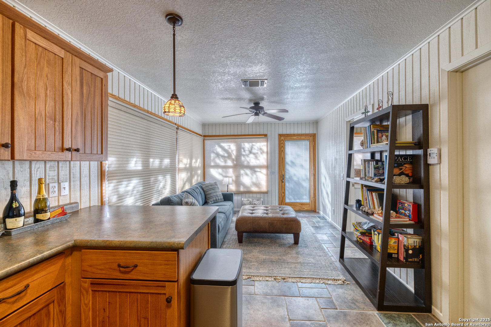 416 Cold Spring River Concan, TX 78838 - Photo 11 of 57 a kitchen with stainless steel appliances granite countertop a stove and cabinets
