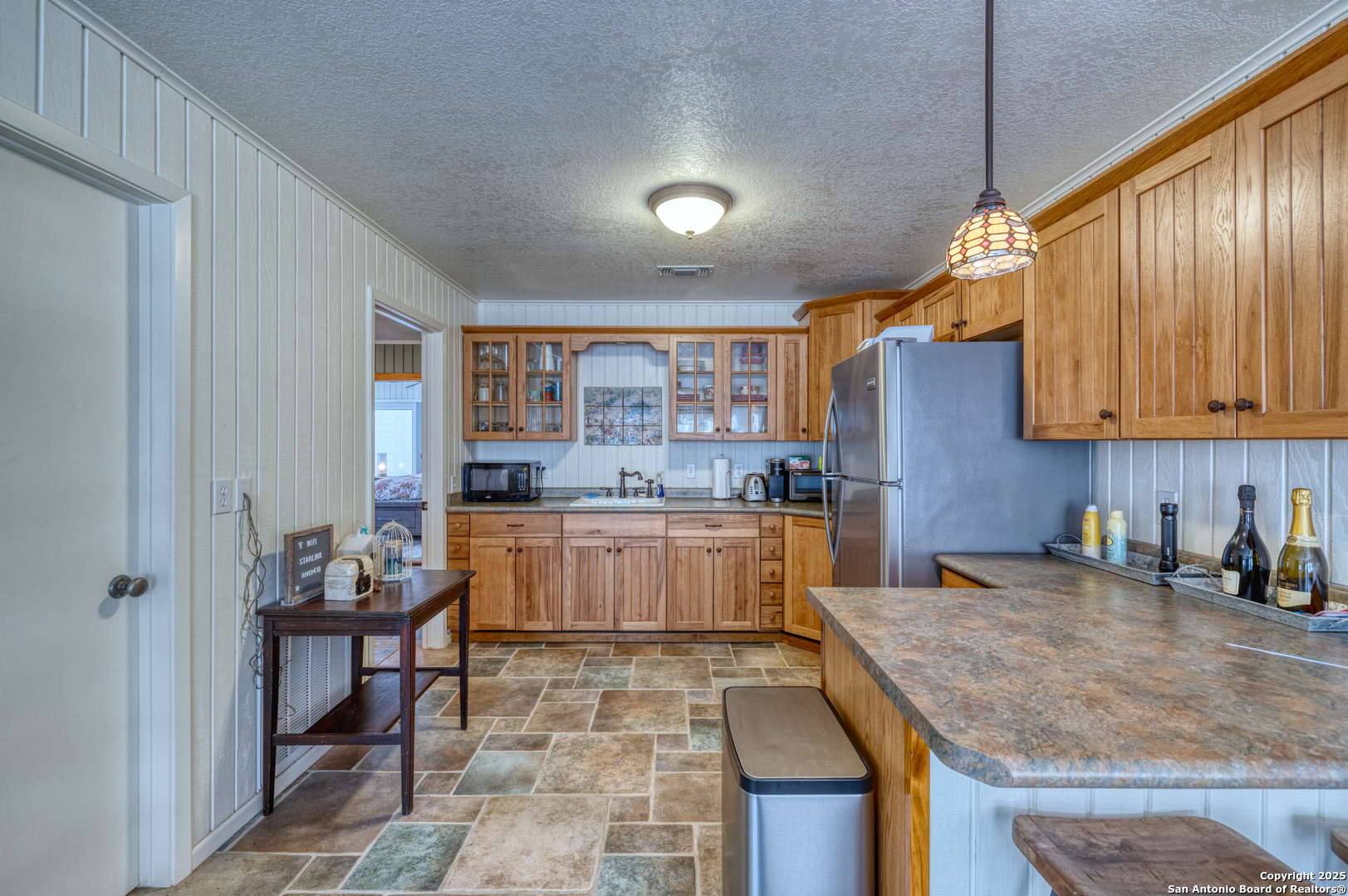 416 Cold Spring River Concan, TX 78838 - Photo 12 of 57 a kitchen with a sink and cabinets