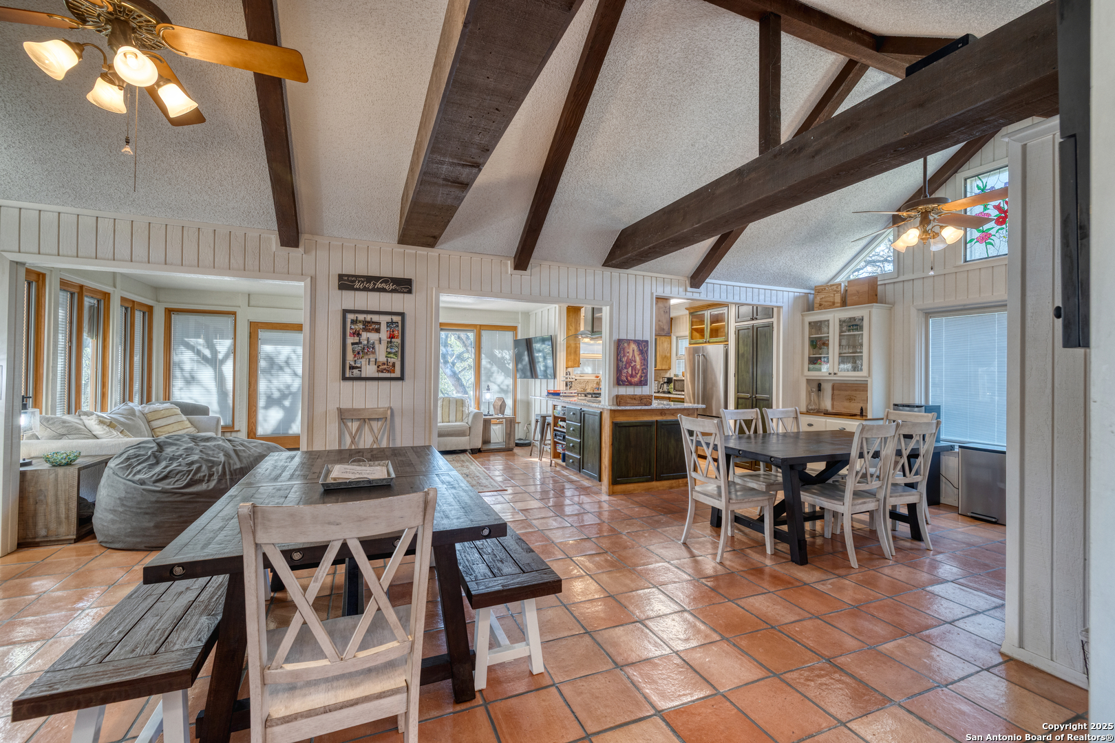 416 Cold Spring River Concan, TX 78838 - Photo 13 of 57 a outdoor space with lots of tables a large window and chairs