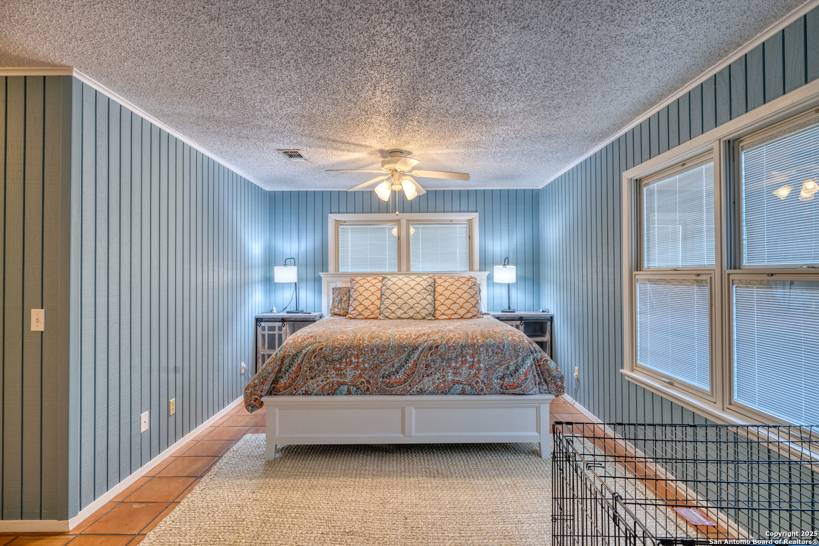 416 Cold Spring River Concan, TX 78838 - Photo 16 of 57 a spacious bedroom with a bed and window
