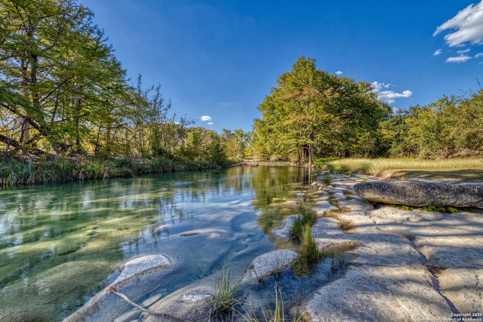 416 Cold Spring River Concan, TX 78838 - Photo 24 of 57 a view of a lake with houses