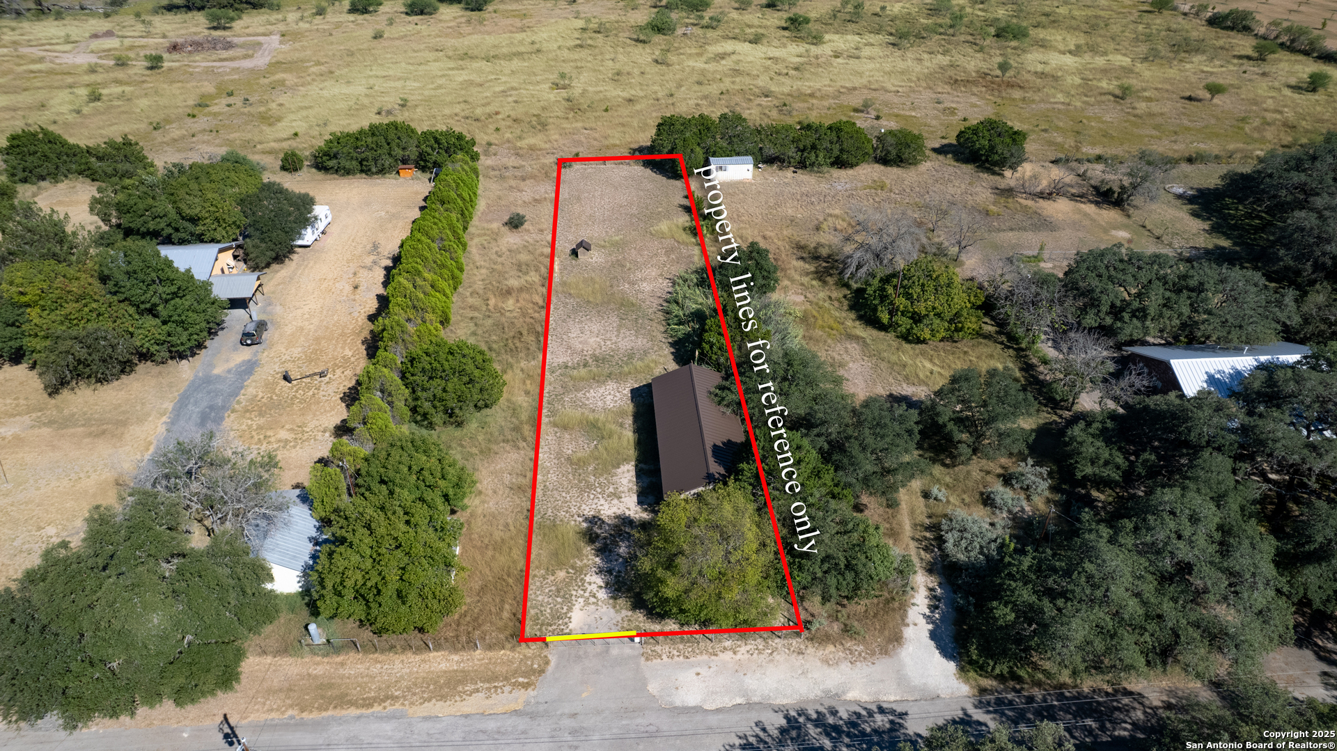 416 Cold Spring River Concan, TX 78838 - Photo 49 of 57 an aerial view of residential houses with outdoor space