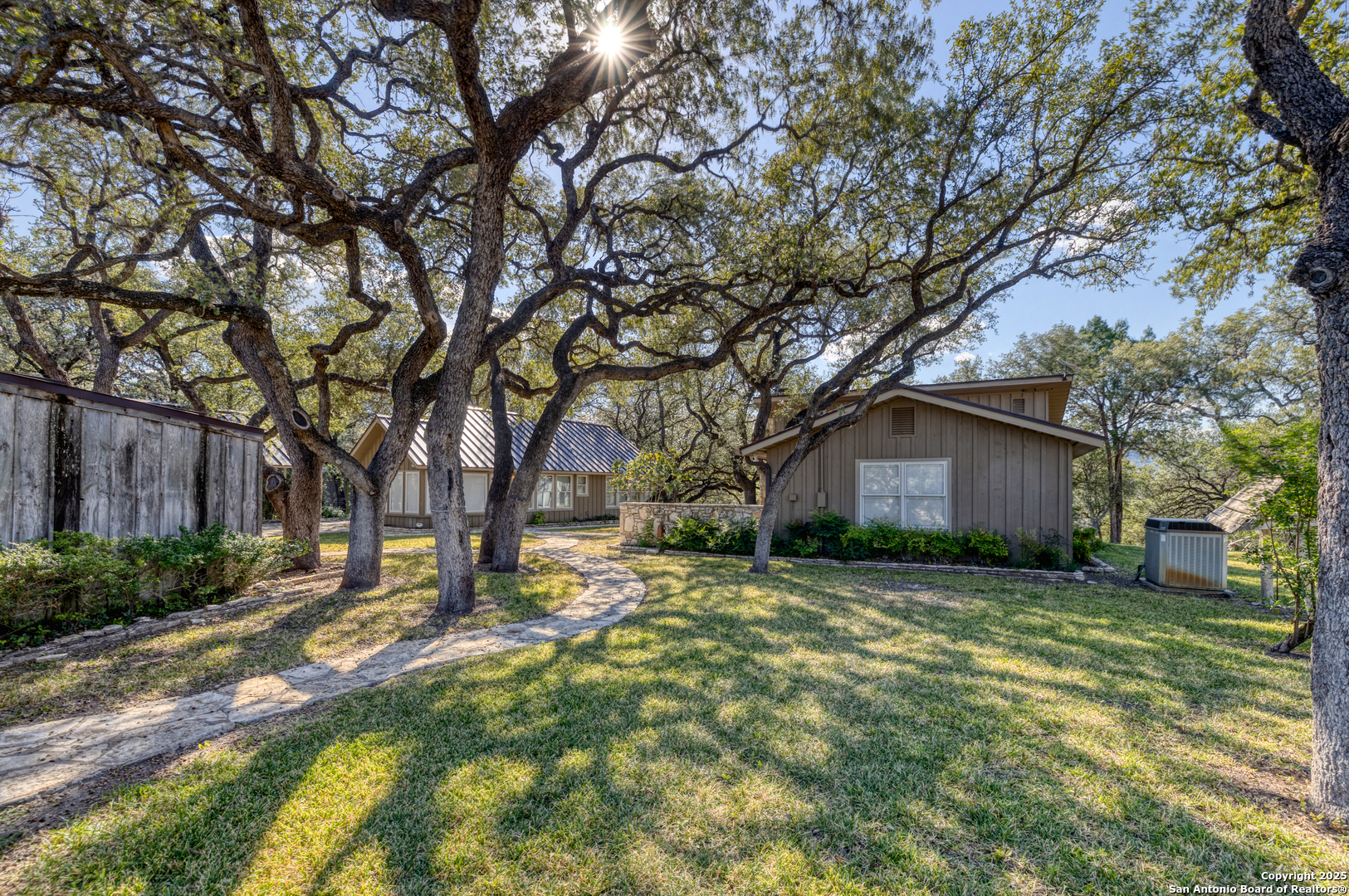 416 Cold Spring River Concan, TX 78838 - Photo 5 of 57 a view of a house with a yard