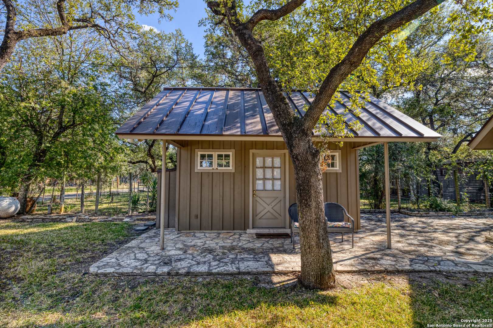 416 Cold Spring River Concan, TX 78838 - Photo 8 of 57 a front view of a house with garden