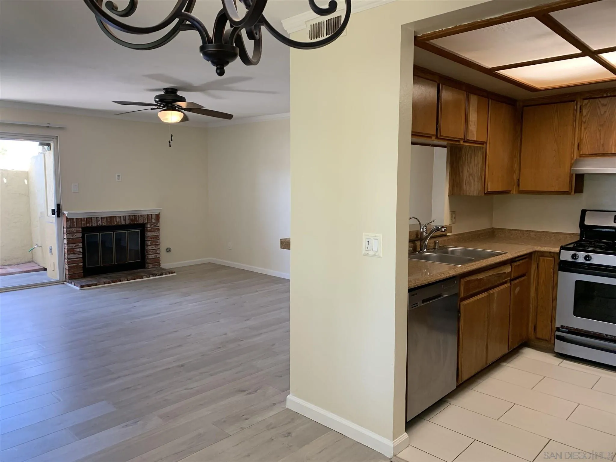 707 Brookstone Road, Unit 101 Chula Vista, CA 91913 - Photo 2 of 7 a kitchen with stainless steel appliances granite countertop a stove and a refrigerator
